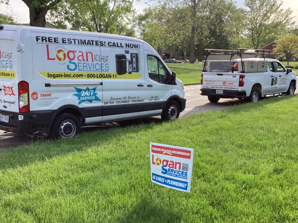 Logan Services yard sign and van