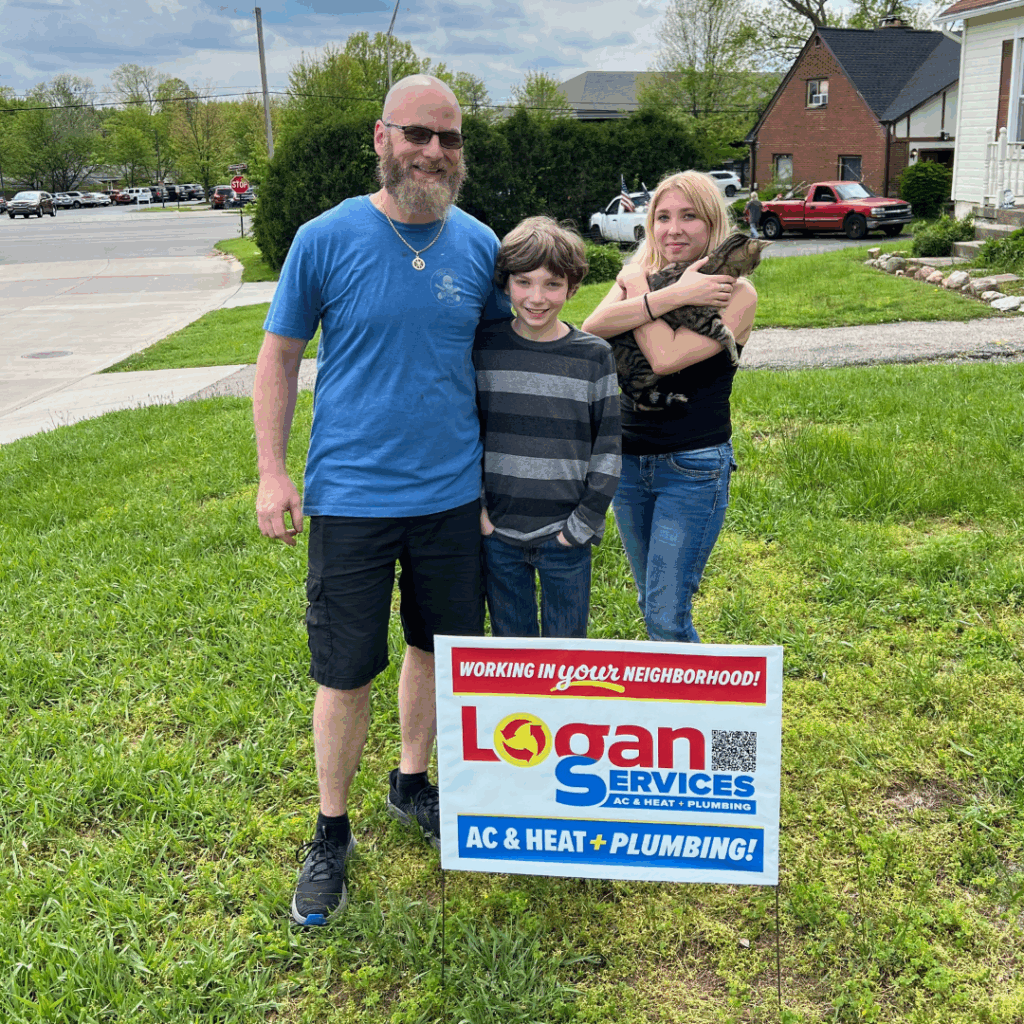Family and dog with Logan Services yard sign.