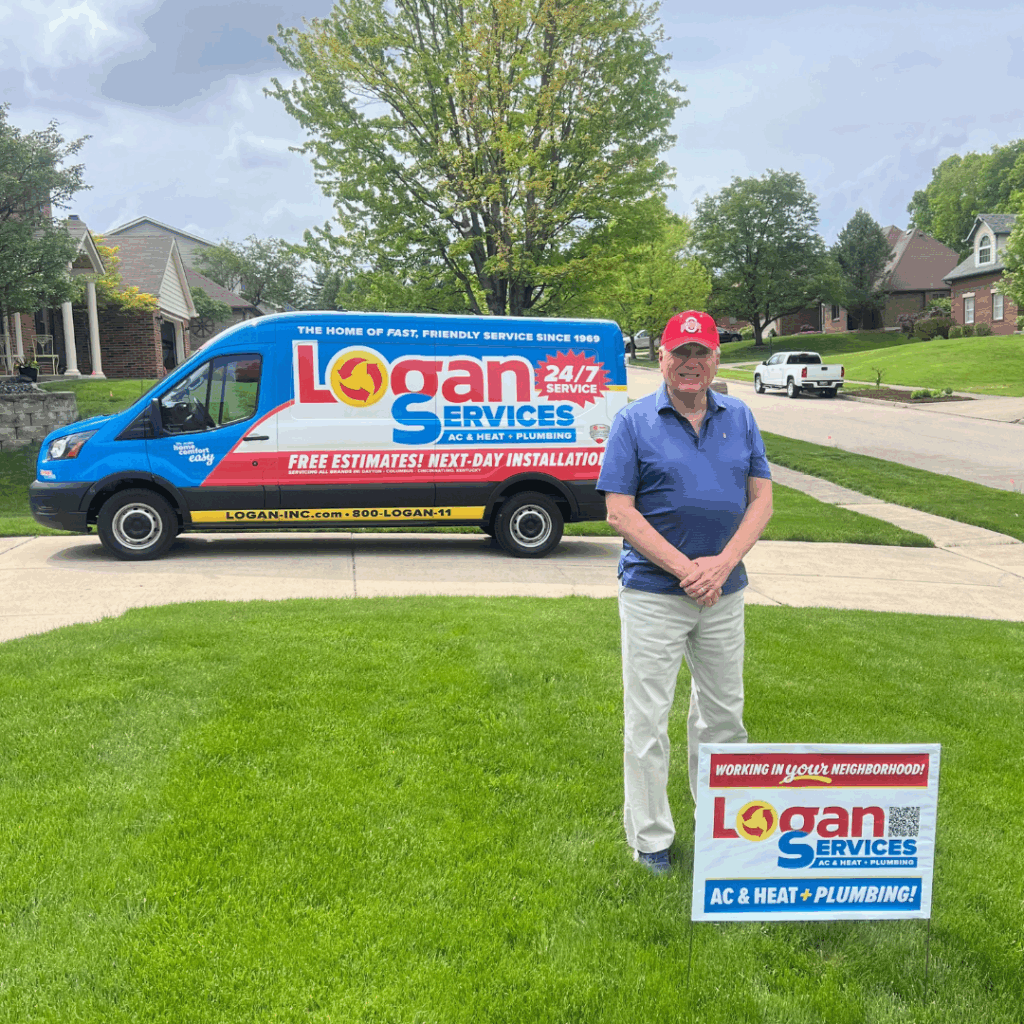 Proud customer posing with a Logan Services yard sign wearing an Ohio State University hat.