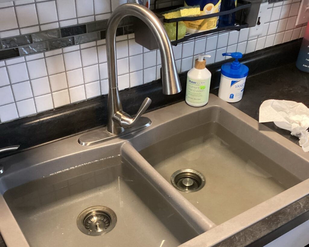 Clogged kitchen sink in a Dayton, OH, home, drain cleared by Logan Services.