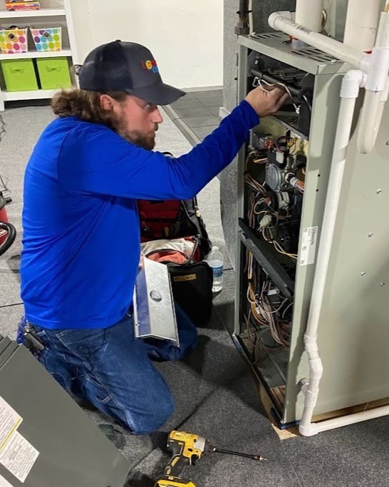 Furnace repair - Logan Services HVAC technician.