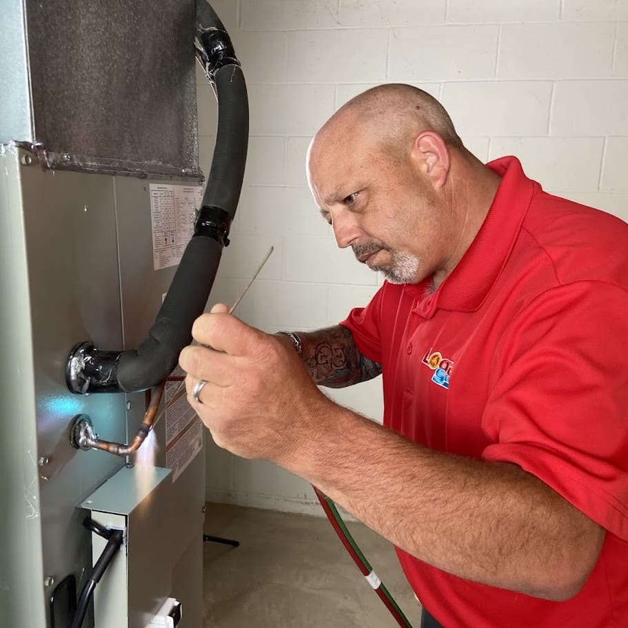 LSI HVAC technician repairing furnace - Columbus