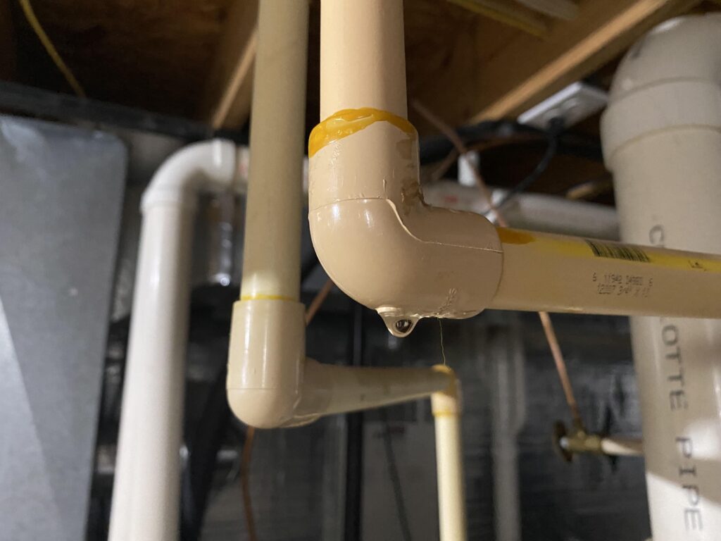 Leak in PVC pipe repaired by Logan Services plumbers.
