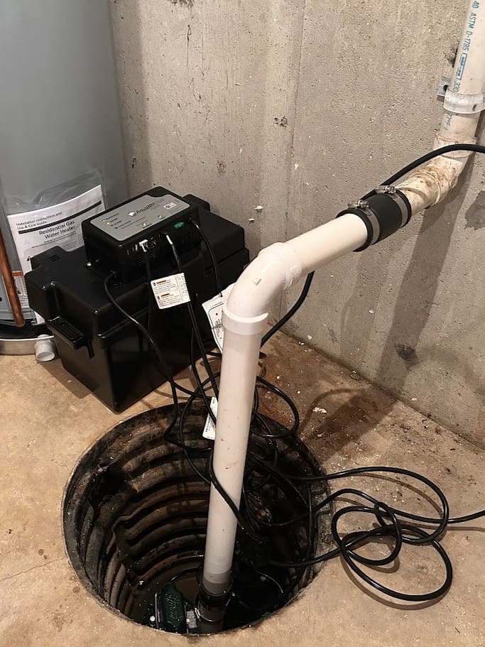 Sump pump battery pack installed by Logan Services plumbers.