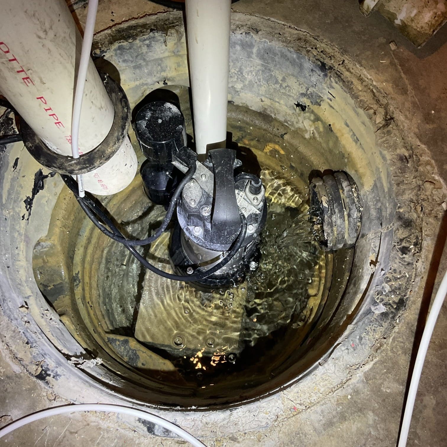 Sump pump maintenance performed by Logan Services plumbers