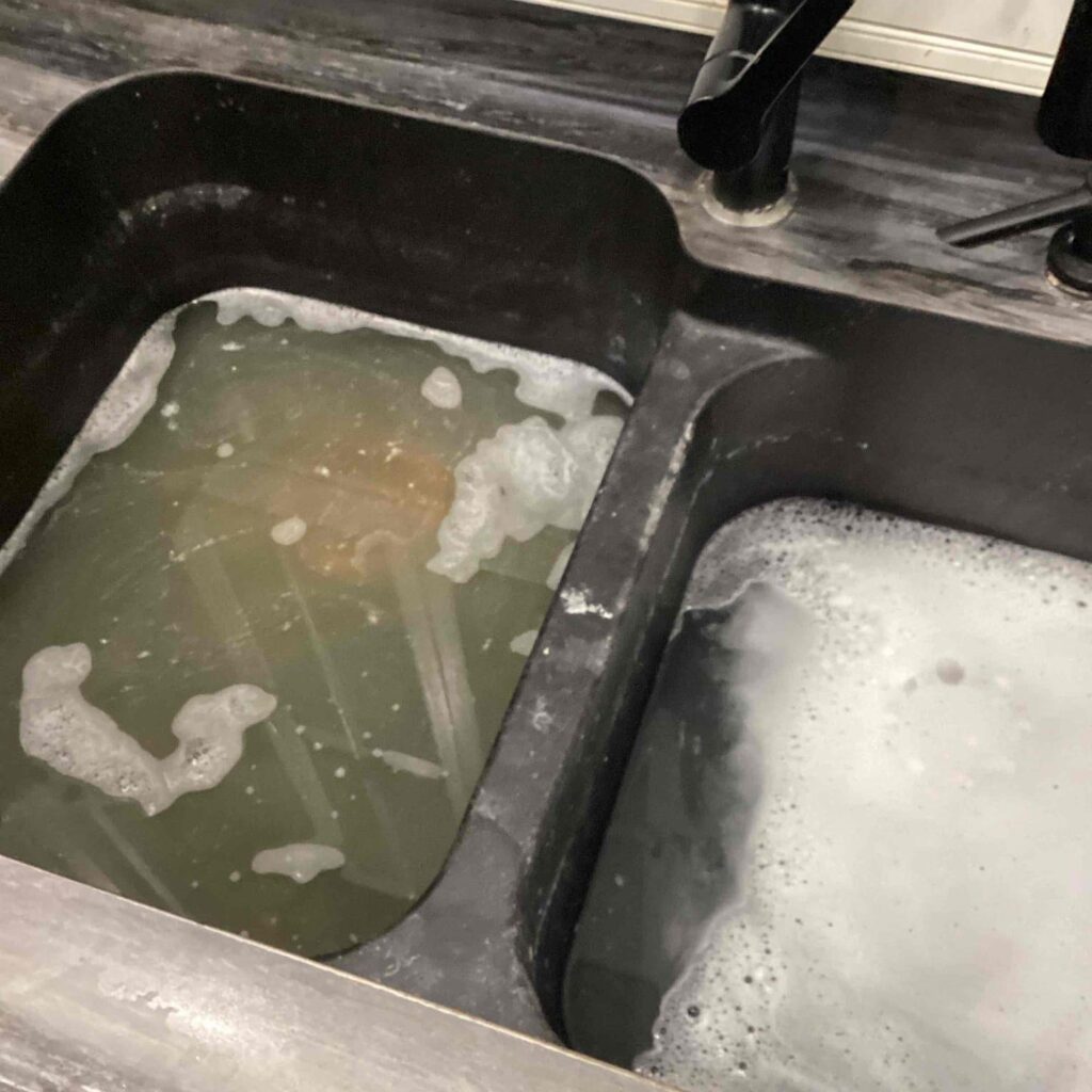 Clogged kitchen sink repaired by Logan Services plumbers