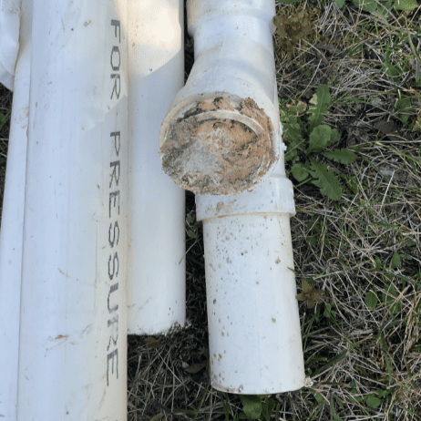 Kitchen pipe clogged with cooking grease, replaced by Logan Services plumbers.