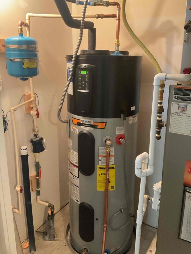 Hybrid heat pump water heater installed by Logan Services plumbers.