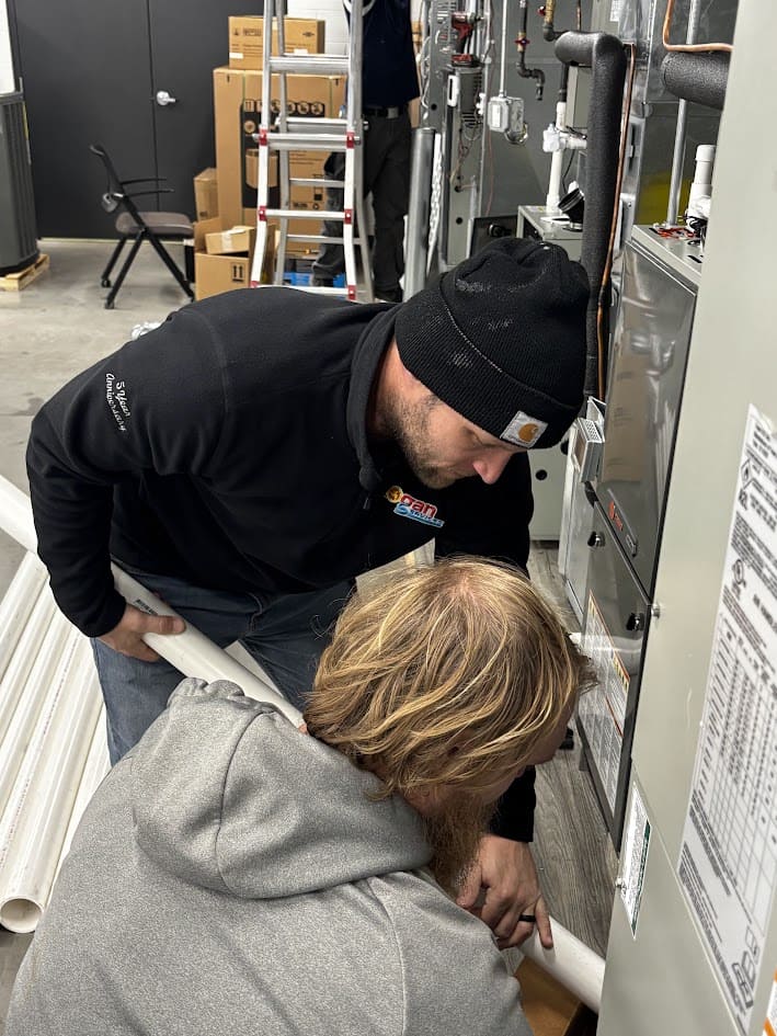 Logan Services HVAC trainer working with installation apprentice