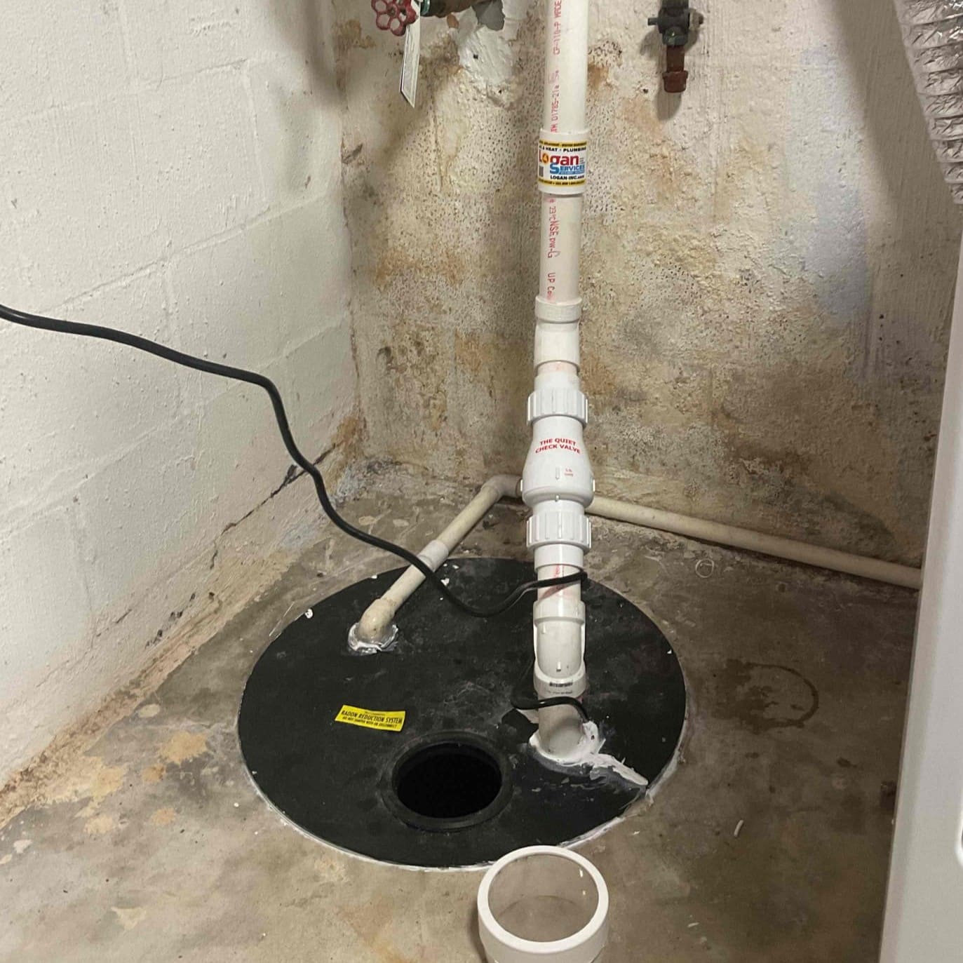 Sump Pump installed and maintained by Logan Services plumbers.