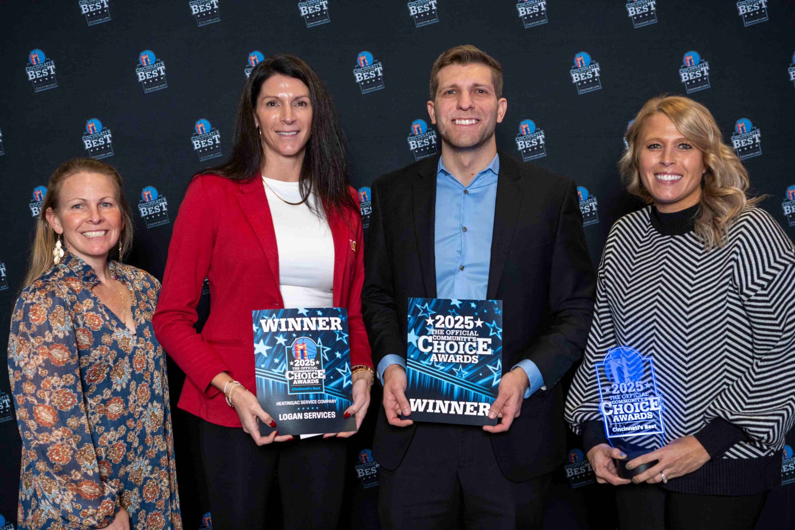 Logan Services employees holding Cincinnati's Choice Awards winner certificate for Best Place to Buy AC & Heating Services.