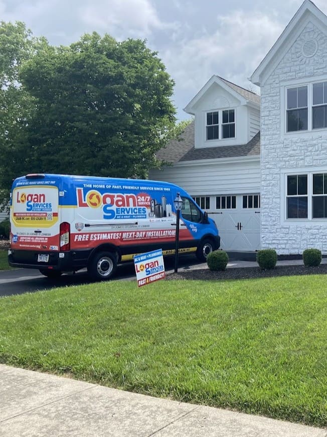 Logan Services van parked outside customer's house.