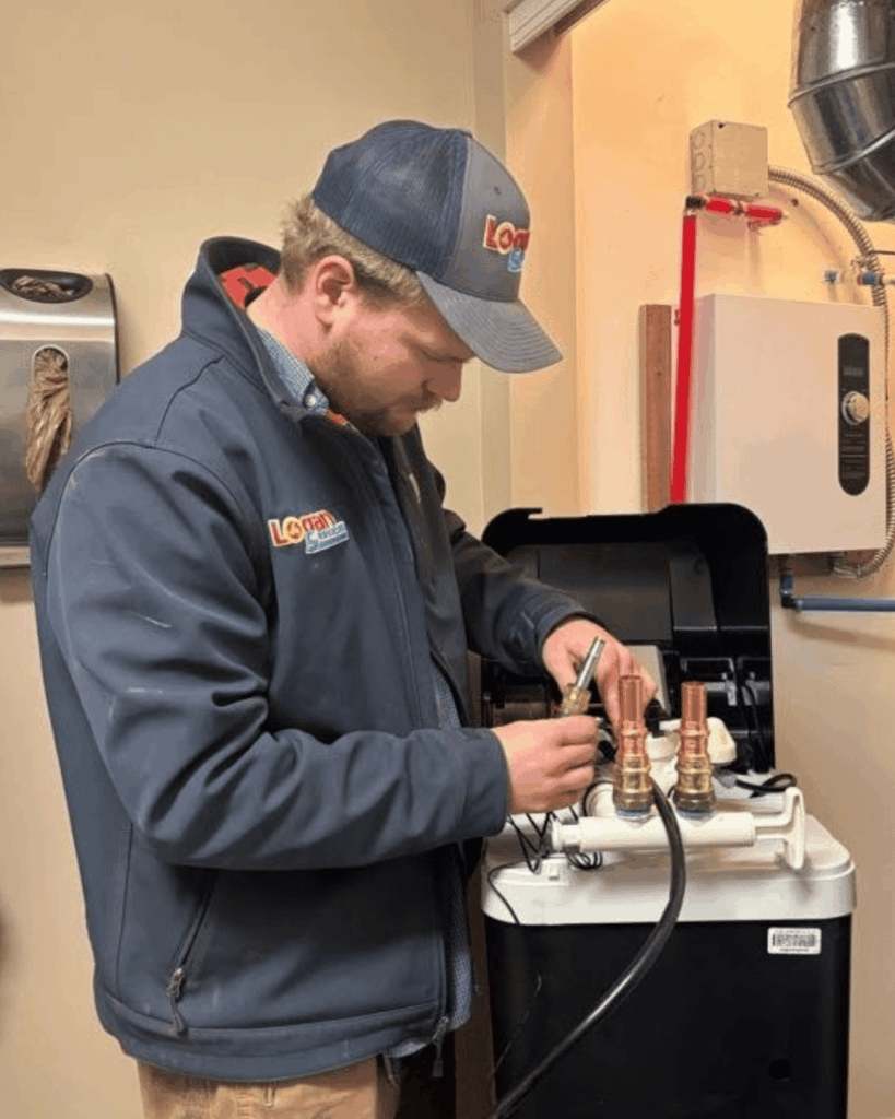 Logan Services plumber installing water softener