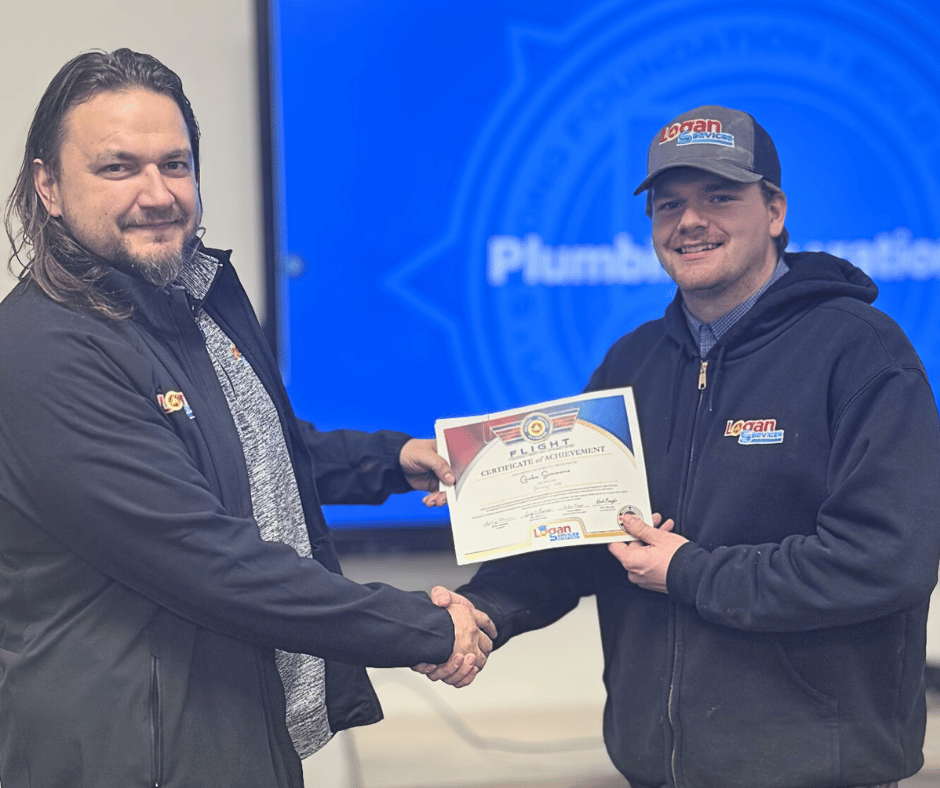 Logan Services plumbers shaking hands