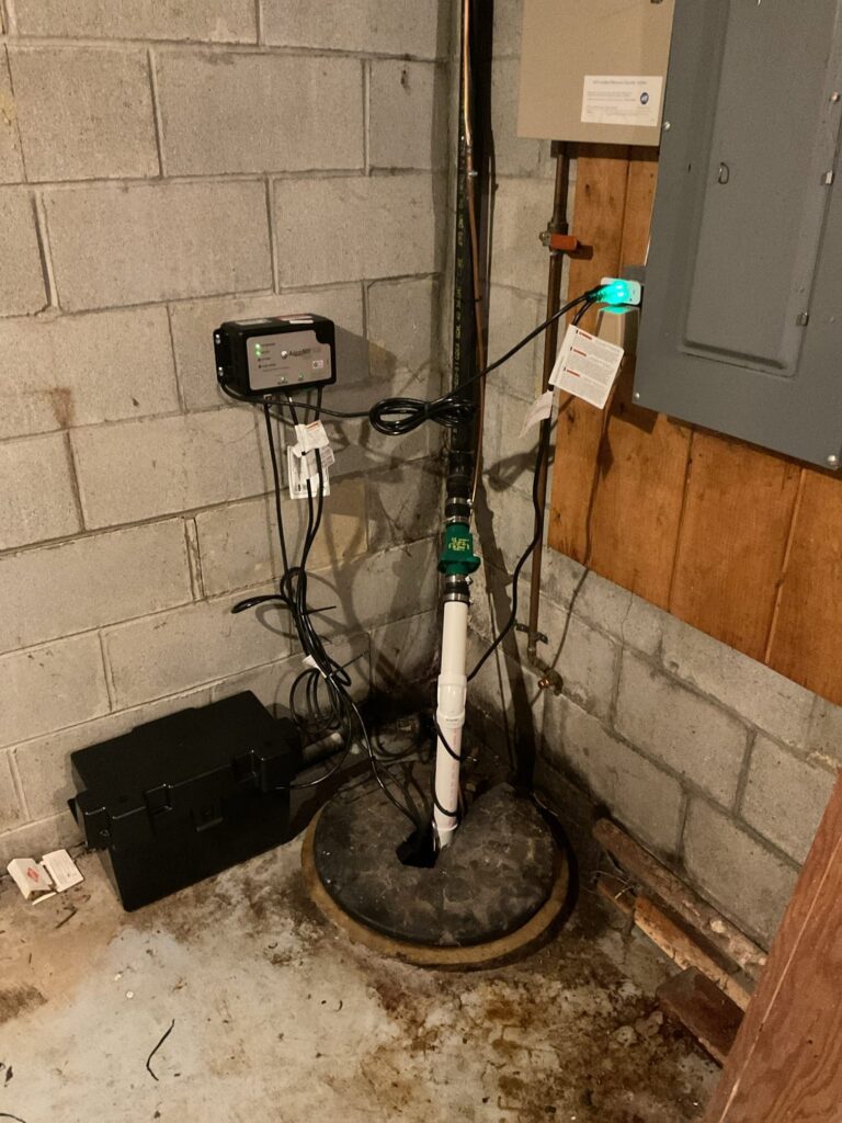 Sump pump and battery backup system installed by Logan Services plumbers.