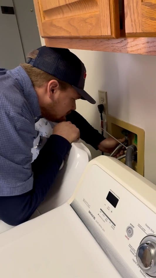 Logan Services plumber inspecting utility water lines