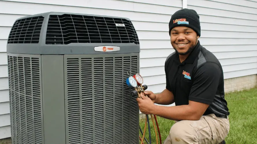 Logan Services HVAC technician performing AC maintenance