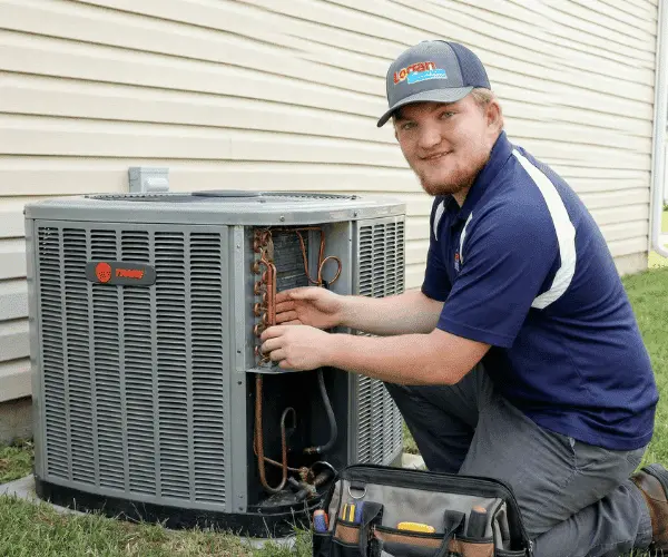 Logan Services HVAC technician conducting AC tune up