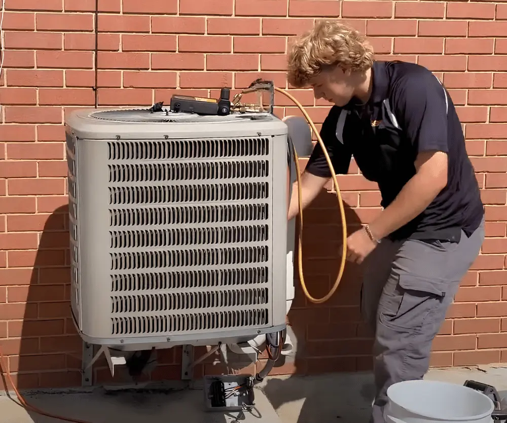 Logan Services HVAC technician removing old AC unit