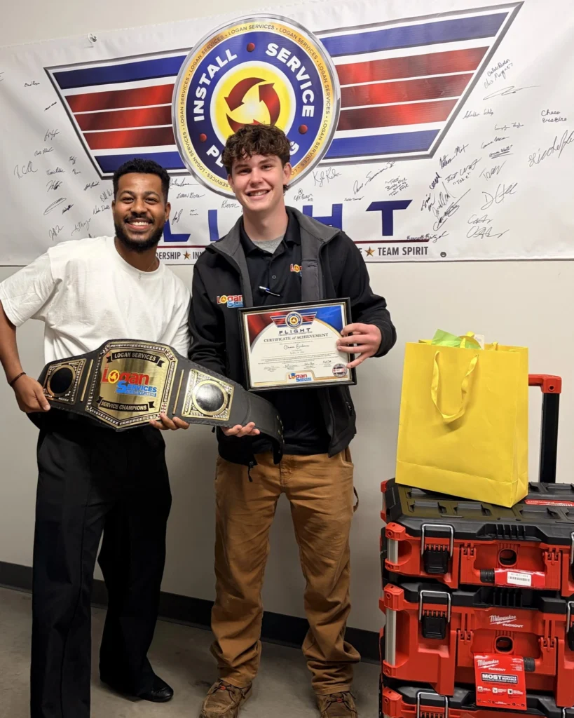 Logan Services service technician posing with Dayton HVAC supervisor, Ryan.